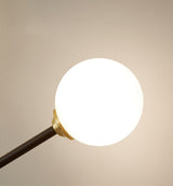 artistic-brass-branch-glass-wall-lamp-with-opal-globes-in-gold-and-black-finish