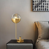 Modern Industrial Brass Globular Table Lamp with Clear Glass Shade for Bedside Lighting