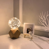 handcrafted-ash-wood-table-lamp-with-white-glass-globe-for-modern-bedside-lighting