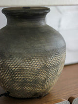 rustic-carved-ceramic-table-lamp-with-white-linen-drum-shade-and-handcrafted-earth-toned-finish