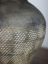 rustic-carved-ceramic-table-lamp-with-white-linen-drum-shade-and-handcrafted-earth-toned-finish