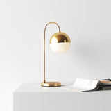 modern-brass-globe-table-lamp-with-glass-shade-cedar-moss-elegant-indoor-accent-light