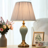 elegant-ceramic-and-brass-table-lamp-with-beige-fabric-shade-for-living-room