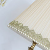 elegant-ceramic-and-brass-table-lamp-with-beige-fabric-shade-for-living-room