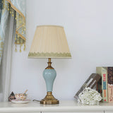 elegant-ceramic-and-brass-table-lamp-with-beige-fabric-shade-for-living-room