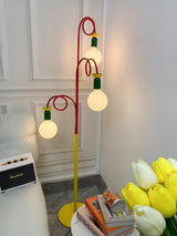 Retro Modern Memphis Style Geometric Floor Lamp with Colorful Accents and Rounded Glass Globe