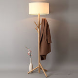 modern-ash-wood-tripod-floor-lamp-with-integrated-coat-rack-and-fabric-shade