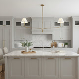 modern-antique-brass-chandelier-with-curved-arms-and-white-tapered-fabric-shades