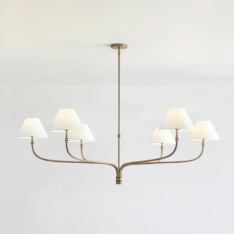 modern-antique-brass-chandelier-with-curved-arms-and-white-tapered-fabric-shades