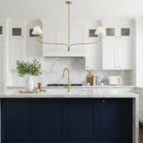 modern-antique-brass-chandelier-with-curved-arms-and-white-tapered-fabric-shades