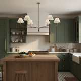 modern-antique-brass-chandelier-with-curved-arms-and-white-tapered-fabric-shades