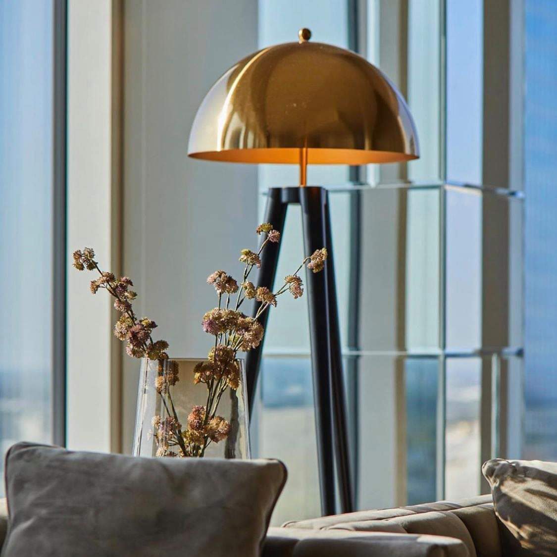 mid-century-modern-tripod-floor-lamp-with-dome-gold-metal-shade-and-black-legs