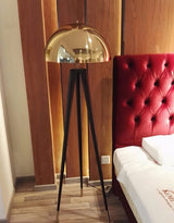mid-century-modern-tripod-floor-lamp-with-dome-gold-metal-shade-and-black-legs