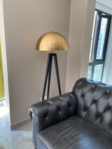 mid-century-modern-tripod-floor-lamp-with-dome-gold-metal-shade-and-black-legs