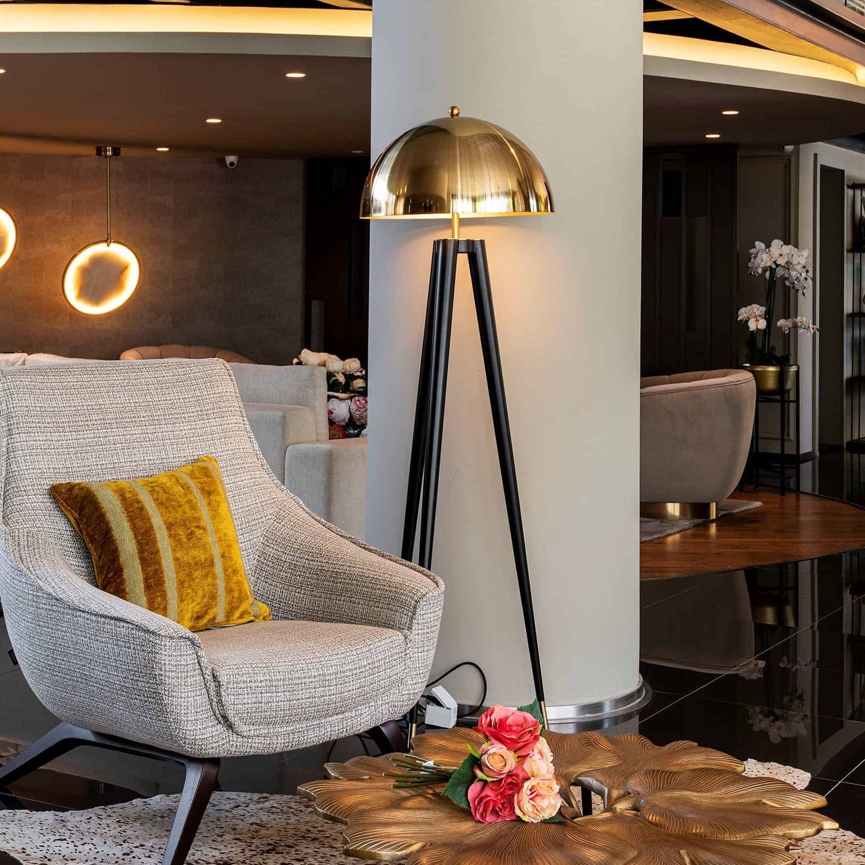 mid-century-modern-tripod-floor-lamp-with-dome-gold-metal-shade-and-black-legs