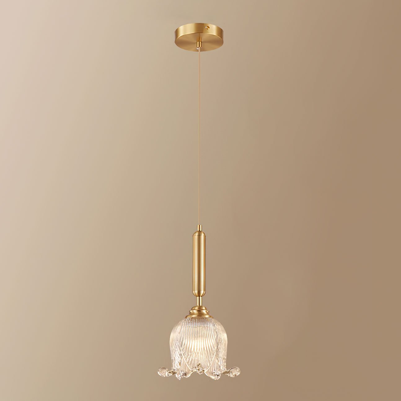 modern-brass-floral-pendant-light-with-clear-crystal-glass-shade-for-dining-areas