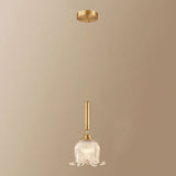 modern-brass-floral-pendant-light-with-clear-crystal-glass-shade-for-dining-areas