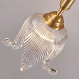 modern-brass-floral-pendant-light-with-clear-crystal-glass-shade-for-dining-areas