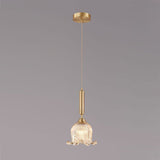 modern-brass-floral-pendant-light-with-clear-crystal-glass-shade-for-dining-areas