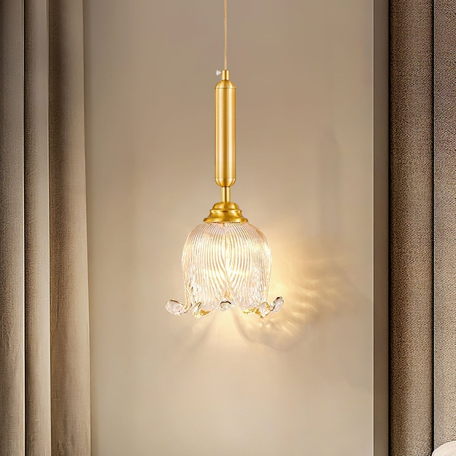 modern-brass-floral-pendant-light-with-clear-crystal-glass-shade-for-dining-areas