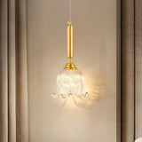 modern-brass-floral-pendant-light-with-clear-crystal-glass-shade-for-dining-areas