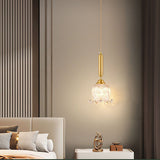 modern-brass-floral-pendant-light-with-clear-crystal-glass-shade-for-dining-areas