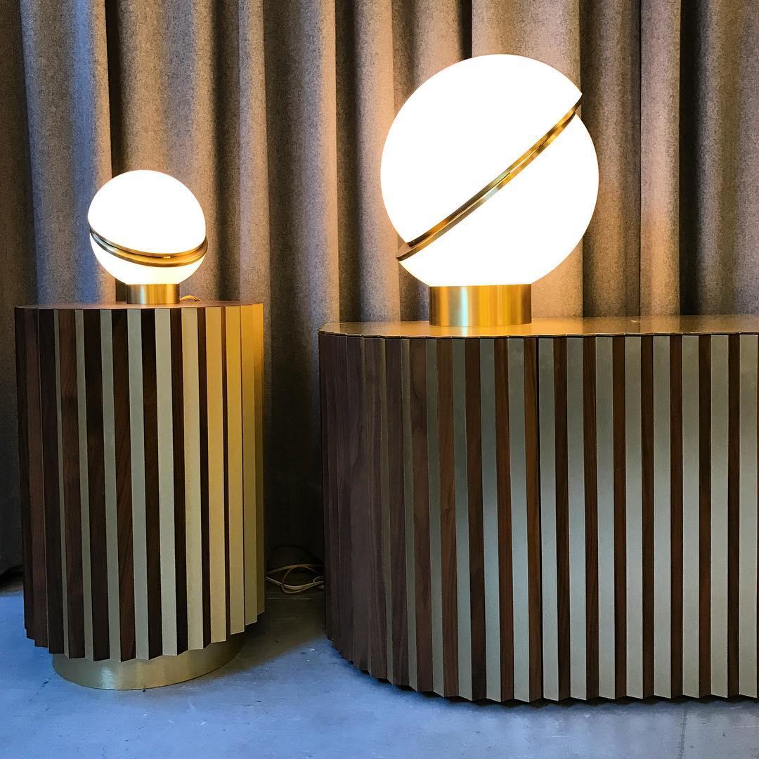 modern-asymmetrical-crescent-table-lamp-with-gold-interior-and-acrylic-globe
