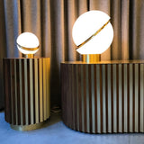 modern-asymmetrical-crescent-table-lamp-with-gold-interior-and-acrylic-globe
