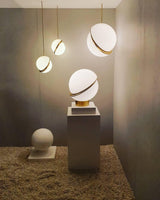 modern-asymmetrical-crescent-table-lamp-with-gold-interior-and-acrylic-globe