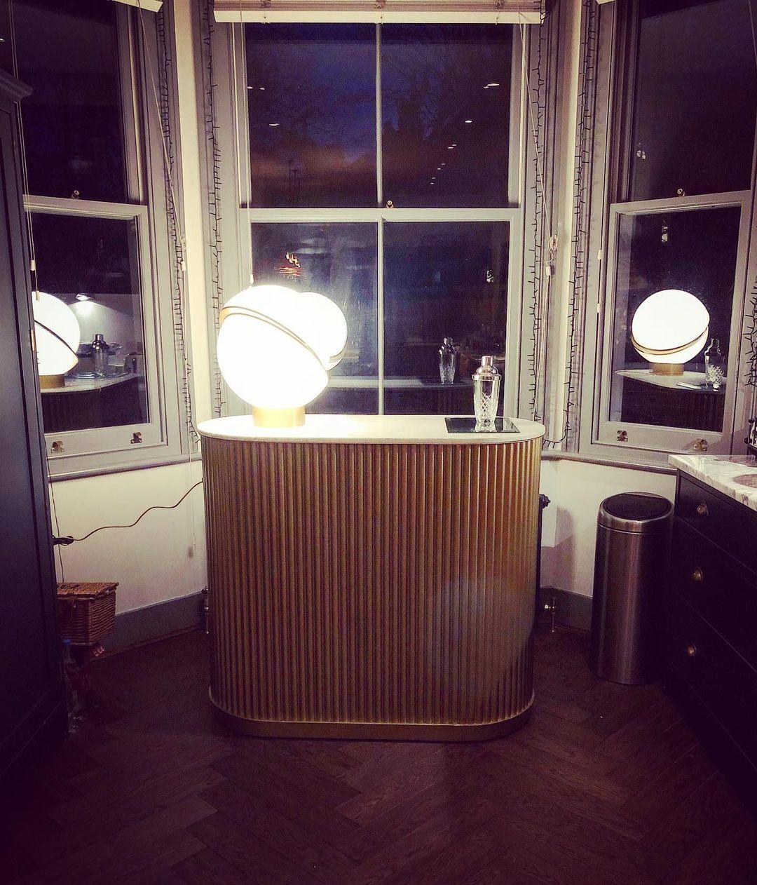 modern-asymmetrical-crescent-table-lamp-with-gold-interior-and-acrylic-globe