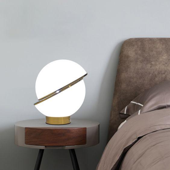 modern-asymmetrical-crescent-table-lamp-with-gold-interior-and-acrylic-globe