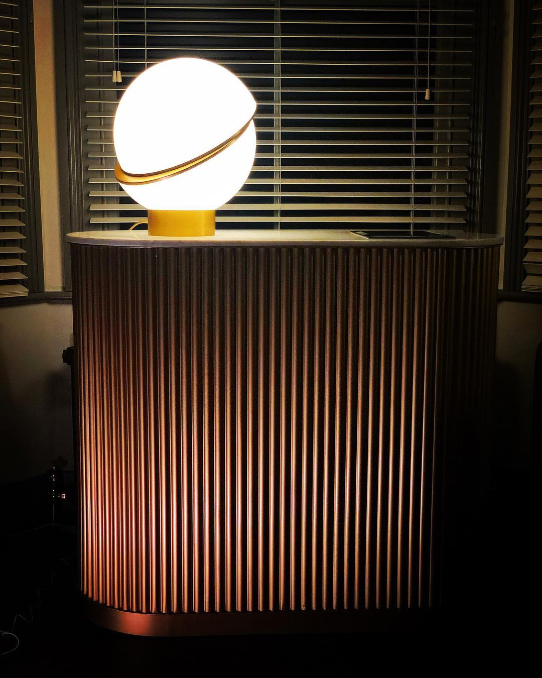 modern-asymmetrical-crescent-table-lamp-with-gold-interior-and-acrylic-globe