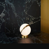 modern-asymmetrical-crescent-table-lamp-with-gold-interior-and-acrylic-globe