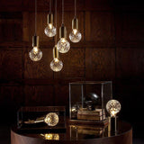 modern-crystal-glass-sphere-table-lamp-with-polished-brass-base-and-warm-led-glow