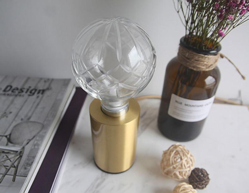 modern-crystal-glass-sphere-table-lamp-with-polished-brass-base-and-warm-led-glow