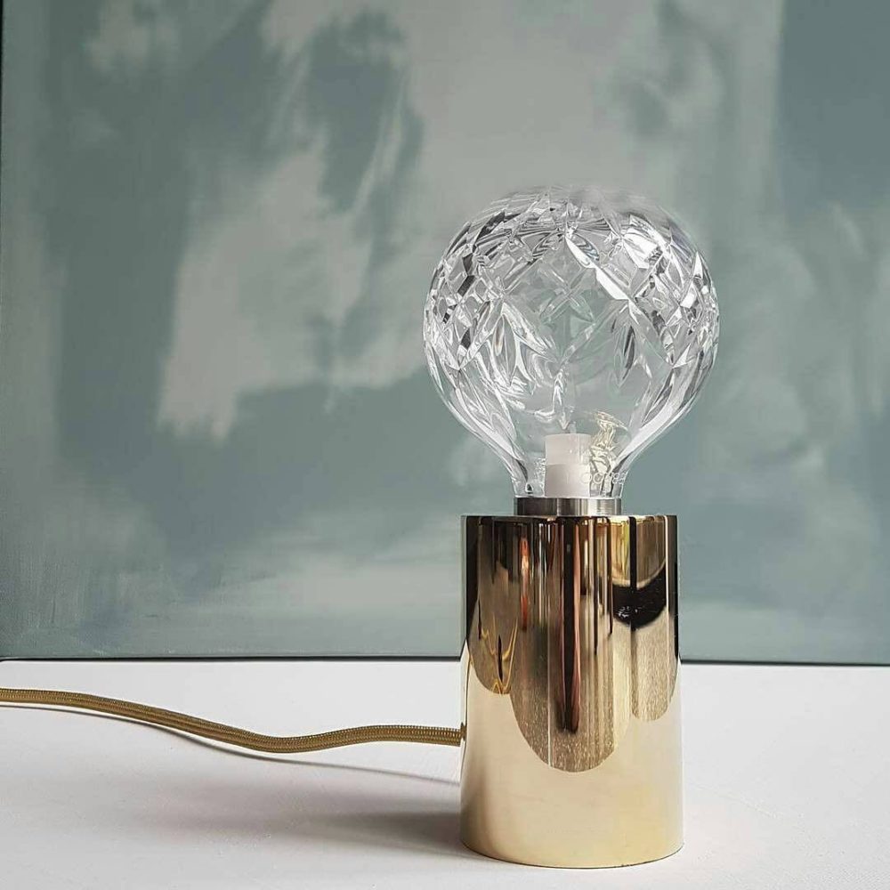 modern-crystal-glass-sphere-table-lamp-with-polished-brass-base-and-warm-led-glow