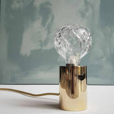 modern-crystal-glass-sphere-table-lamp-with-polished-brass-base-and-warm-led-glow