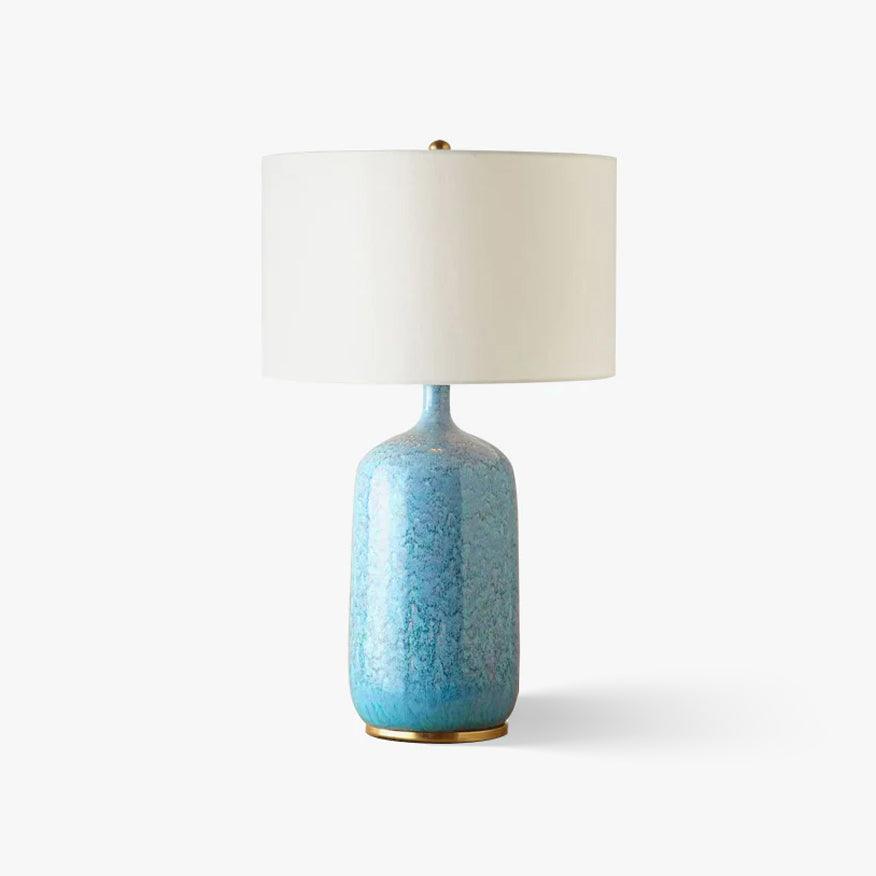 blue-ceramic-table-lamp-with-reactive-glaze-finish-and-white-linen-drum-shade