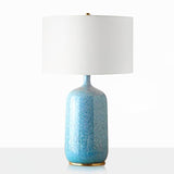 blue-ceramic-table-lamp-with-reactive-glaze-finish-and-white-linen-drum-shade