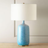 blue-ceramic-table-lamp-with-reactive-glaze-finish-and-white-linen-drum-shade