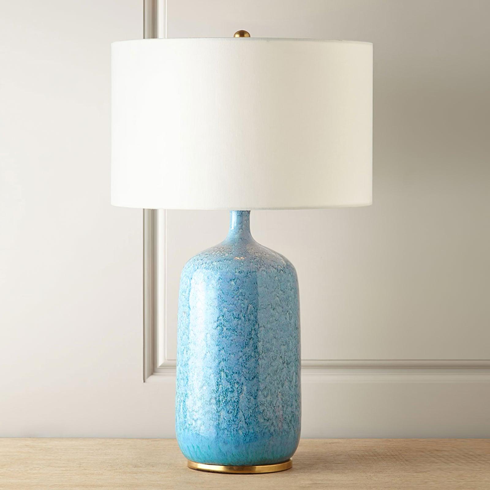 blue-ceramic-table-lamp-with-reactive-glaze-finish-and-white-linen-drum-shade