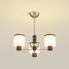 modern-glass-cylinder-chandelier-with-wood-and-metal-accents-for-dining-and-living-rooms