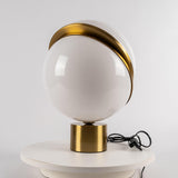 modern-asymmetrical-crescent-table-lamp-with-gold-interior-and-acrylic-globe