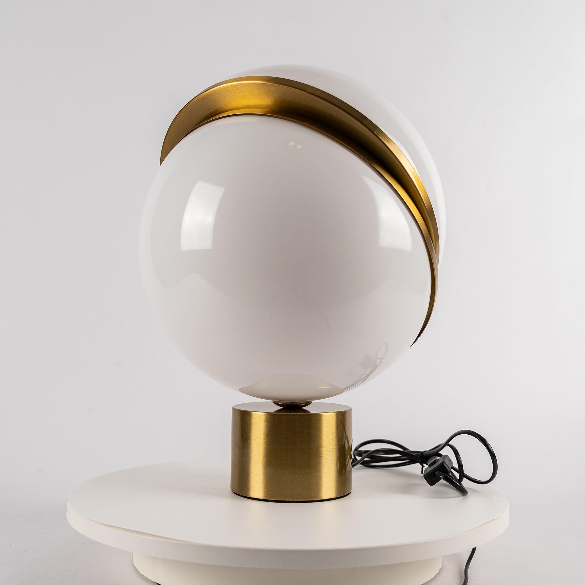 modern-asymmetrical-crescent-table-lamp-with-gold-interior-and-acrylic-globe