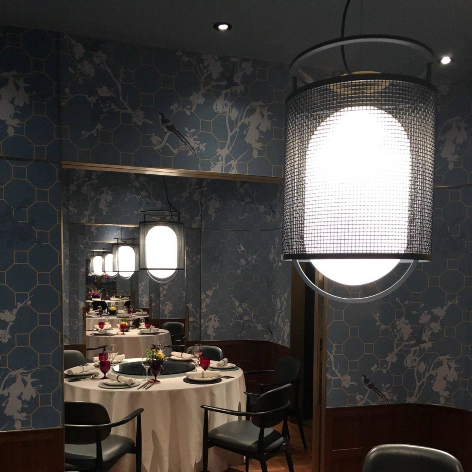 modern-industrial-black-cage-pendant-light-with-oval-fiberglass-shade-for-living-room