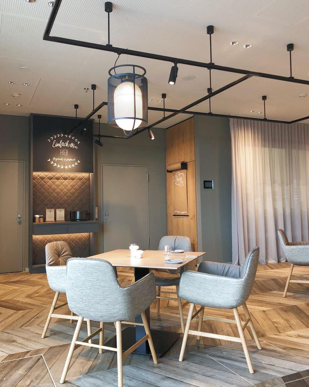 modern-industrial-black-cage-pendant-light-with-oval-fiberglass-shade-for-living-room