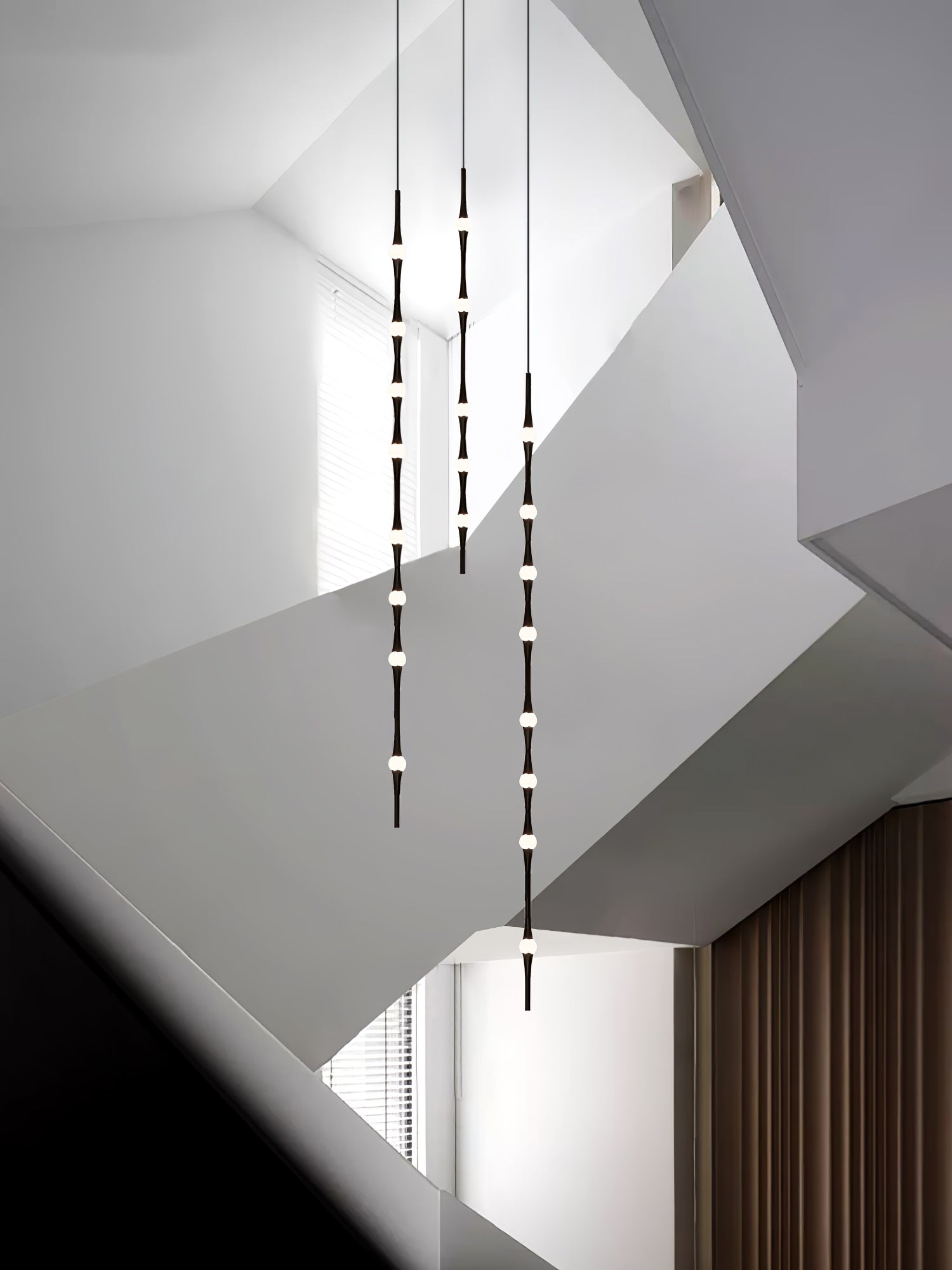 dew-explores-modern-linear-led-pendant-light-with-organic-oval-points-for-stairwells