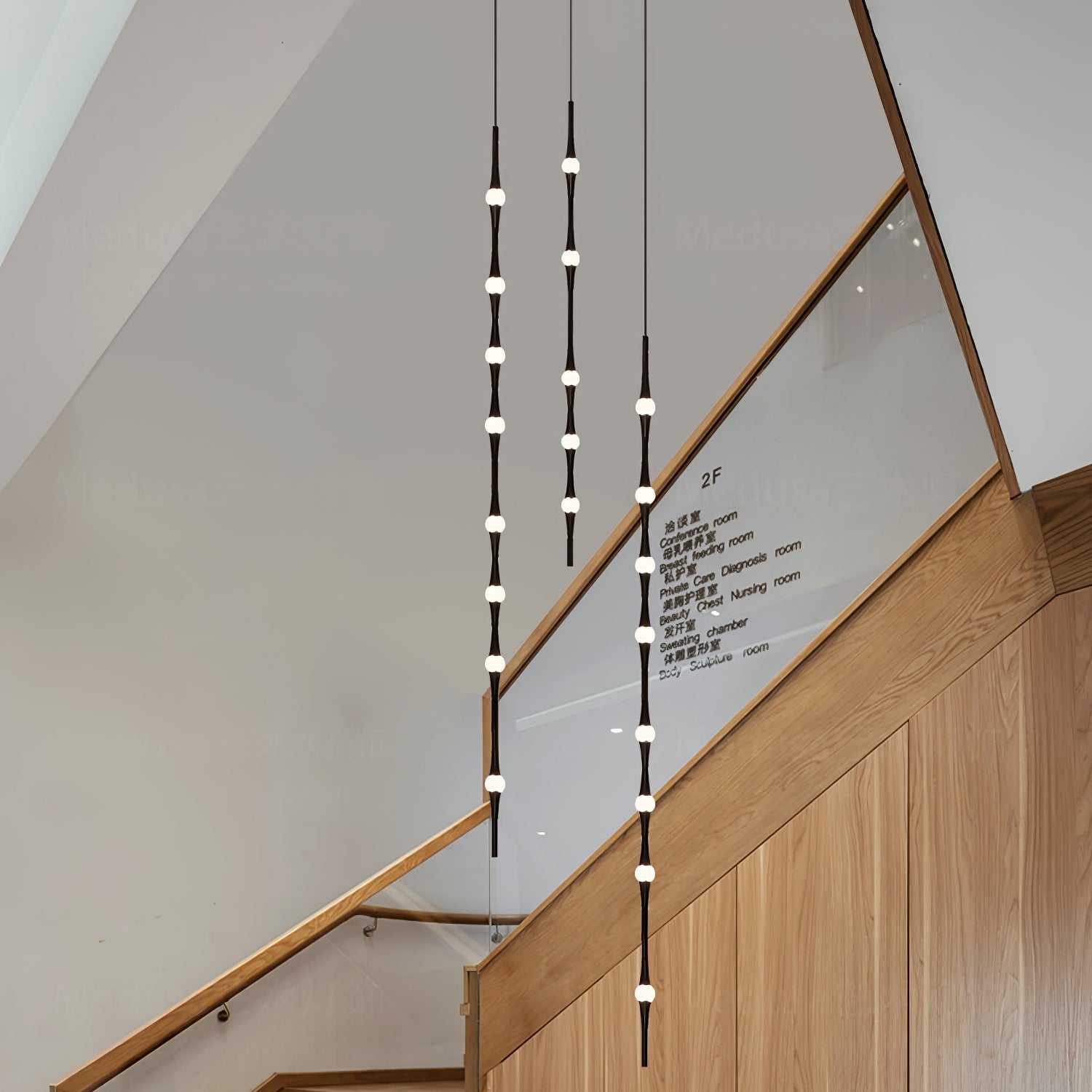 dew-explores-modern-linear-led-pendant-light-with-organic-oval-points-for-stairwells