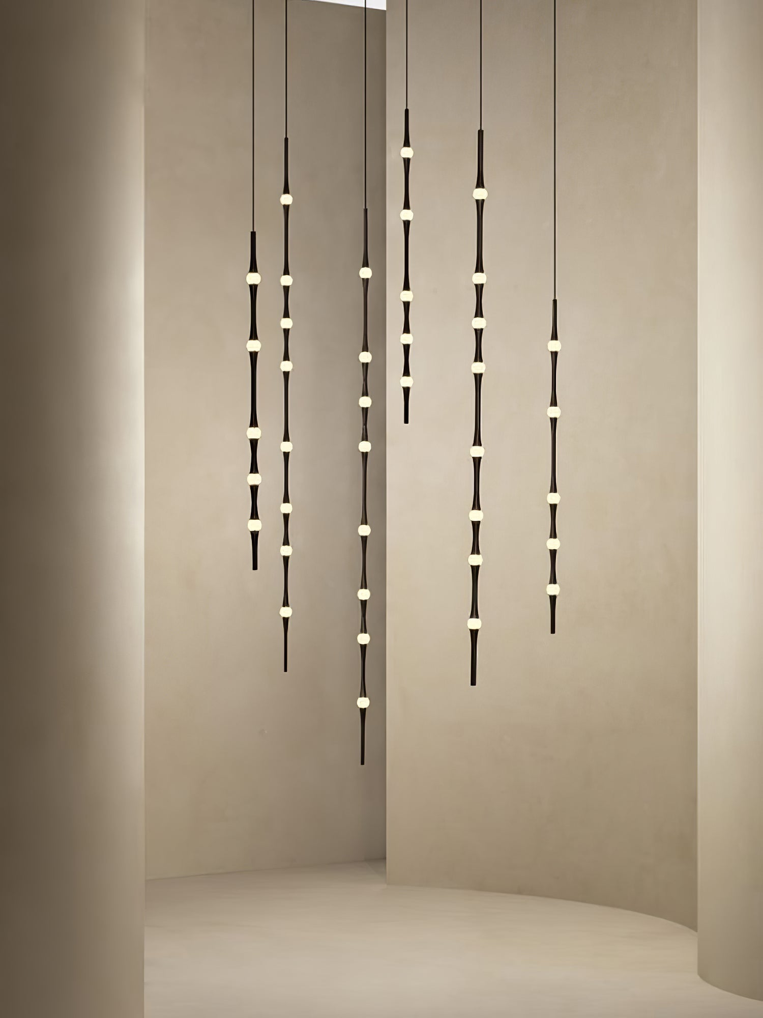dew-explores-modern-linear-led-pendant-light-with-organic-oval-points-for-stairwells