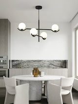 modern-metal-and-glass-globe-pendant-light-for-dining-room-in-gold-and-black-finish